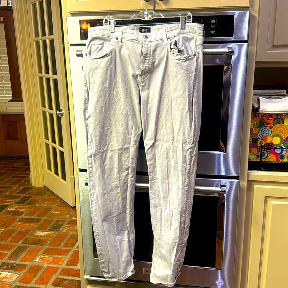PAIGE stretch light khakis with minor bleach stains